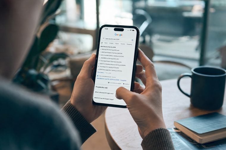 Person viewing search engine results on a smartphone