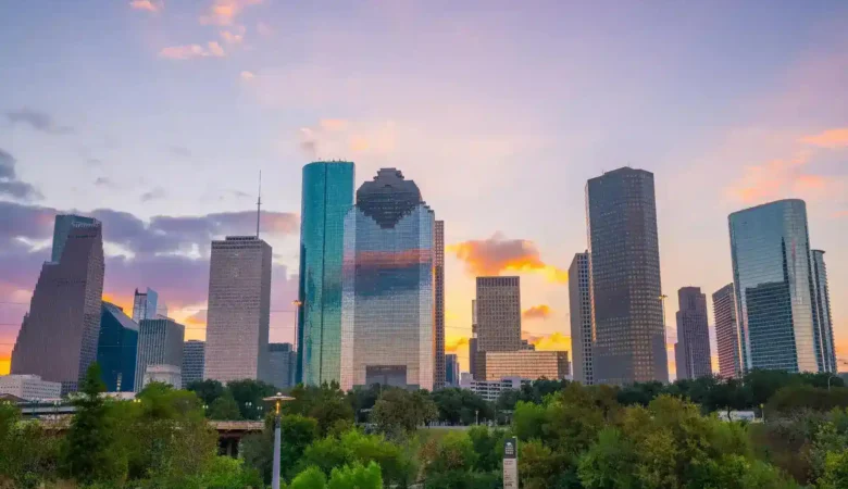 A stunning sunset casting a golden glow over the Houston skyline, illustrating the transformative impact of SEO for law firm websites.