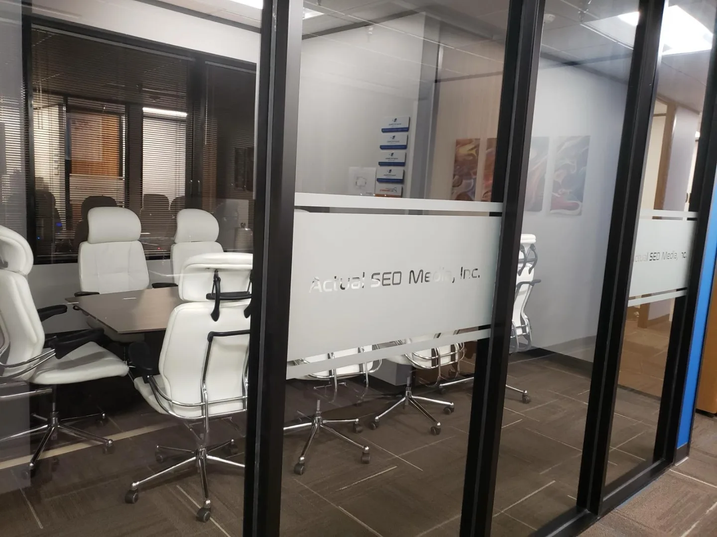 Glass conference room entrance at our Dairy Ashford office