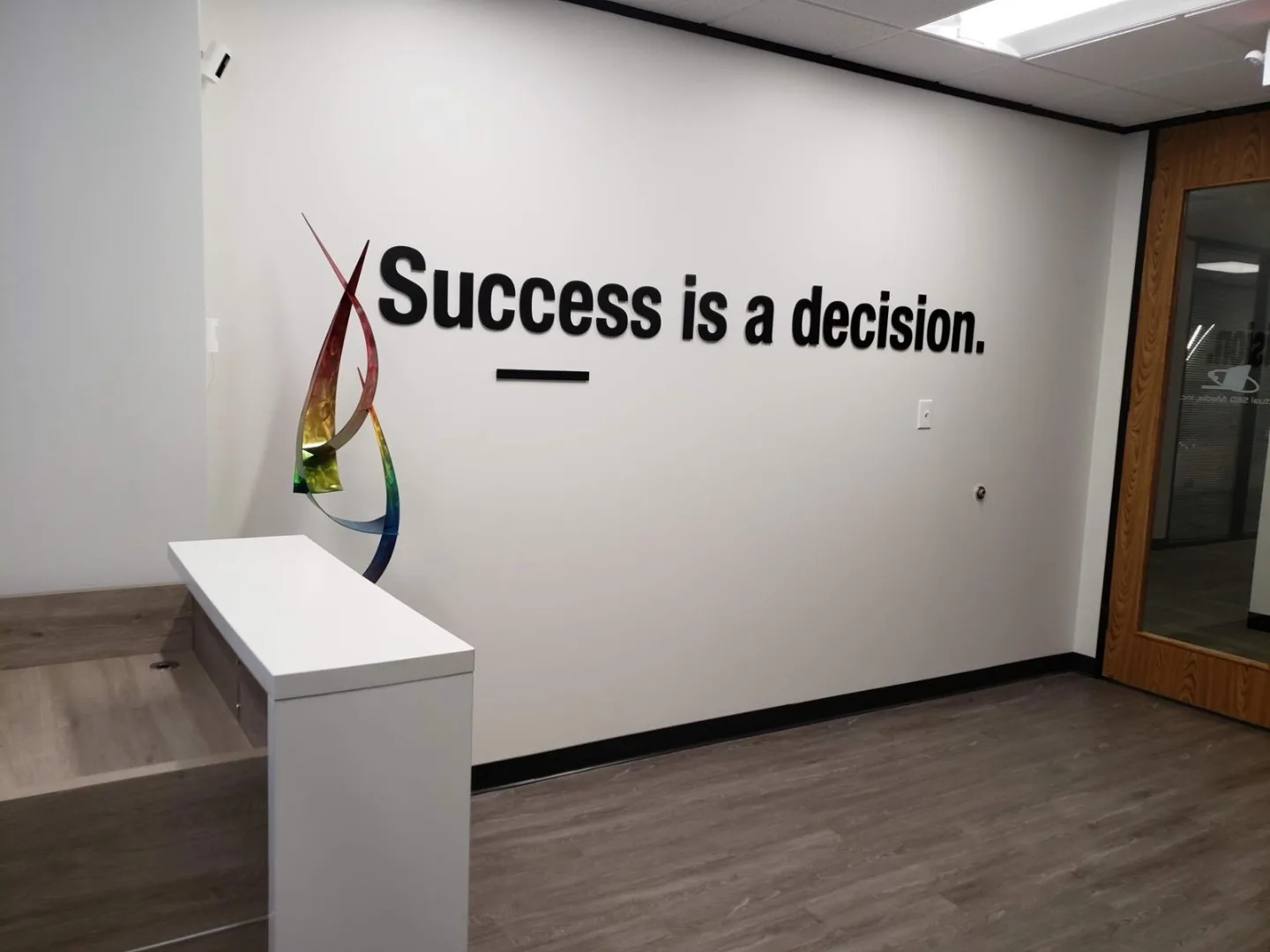 Reception area and quote wall at the Actual SEO Media, Inc. Dairy Ashford office