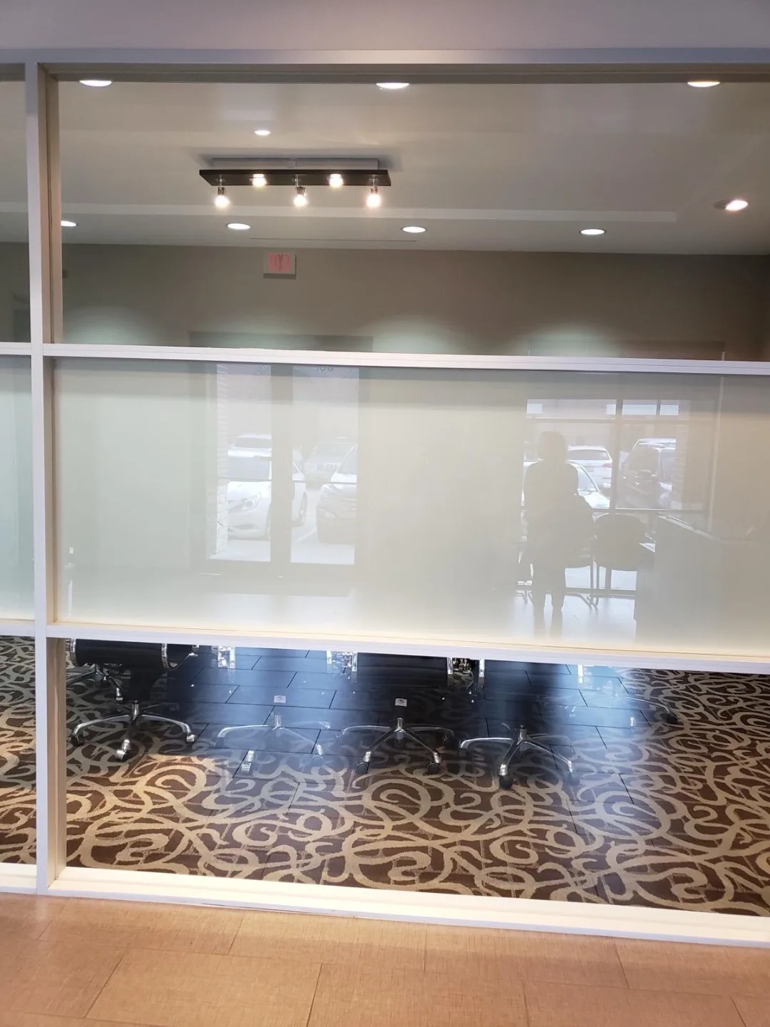 Glass-walled conference room at the Actual SEO Media, Inc. Katy office