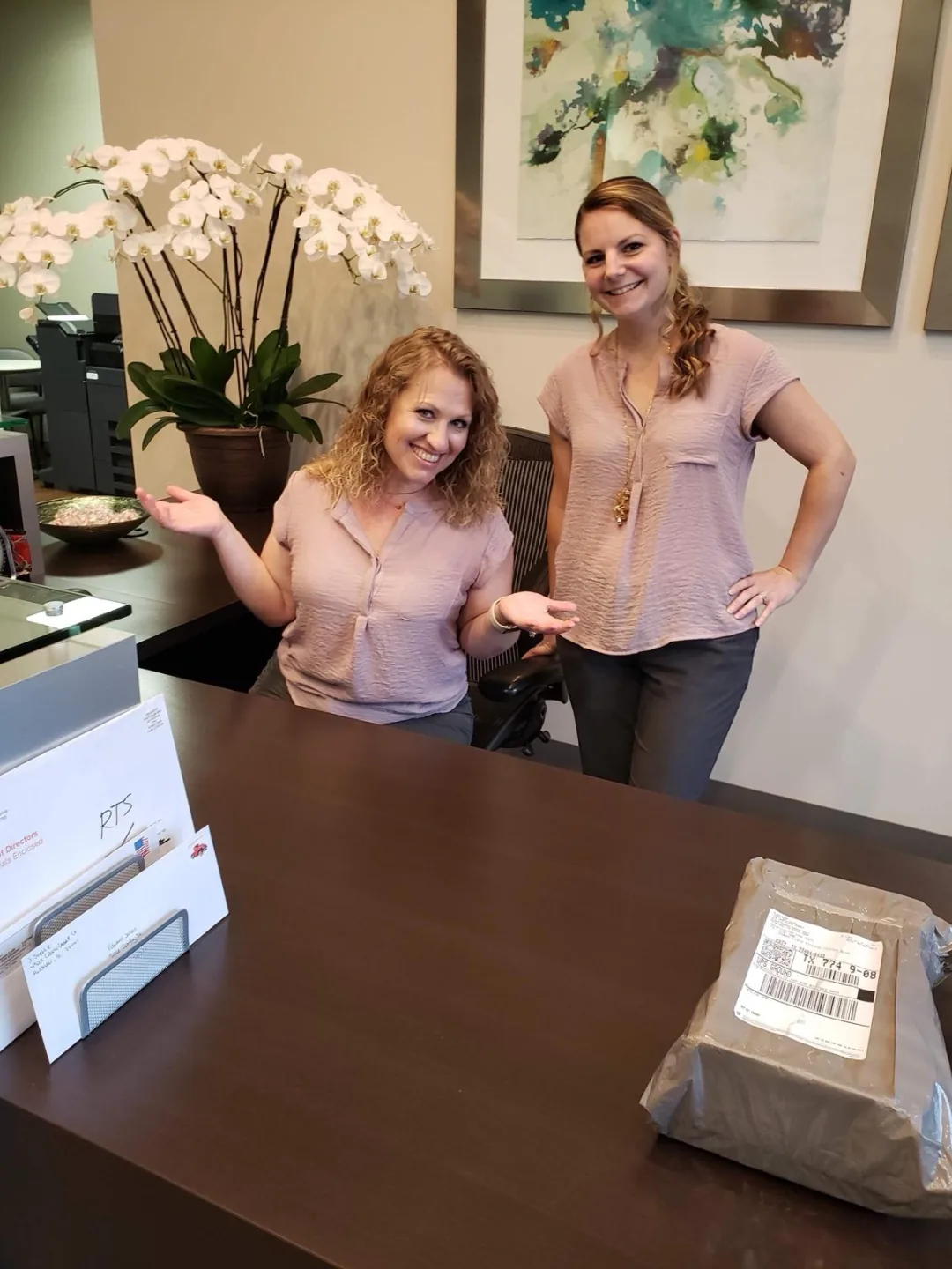Team members processing mail at the Actual SEO Media, Inc. Katy office