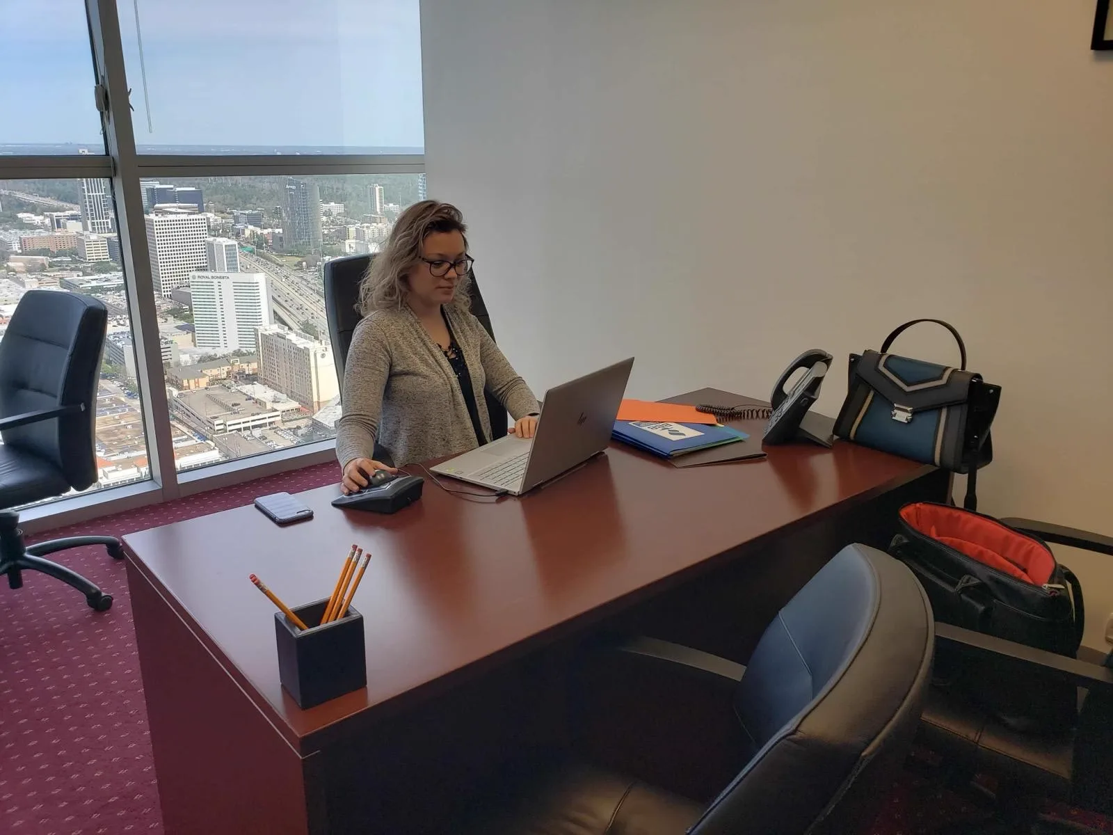 Actual SEO Media, Inc. strategist working at the Williams Tower office desk