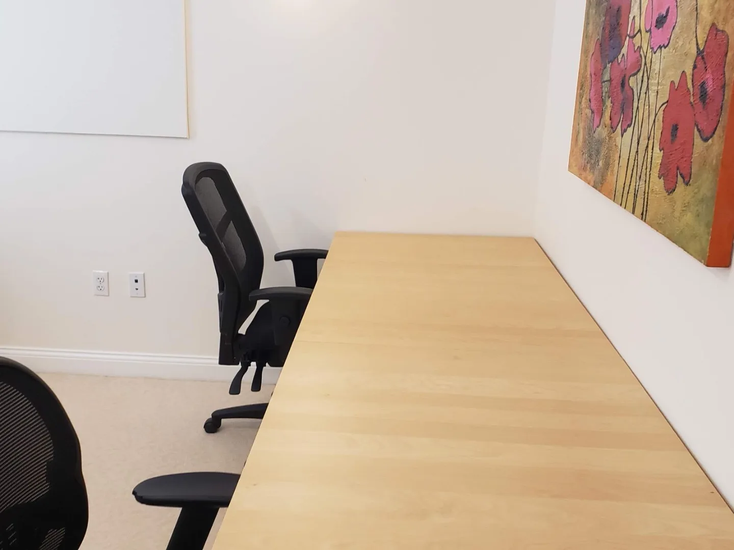 Additional workstation view inside a private office at our Woodlands office
