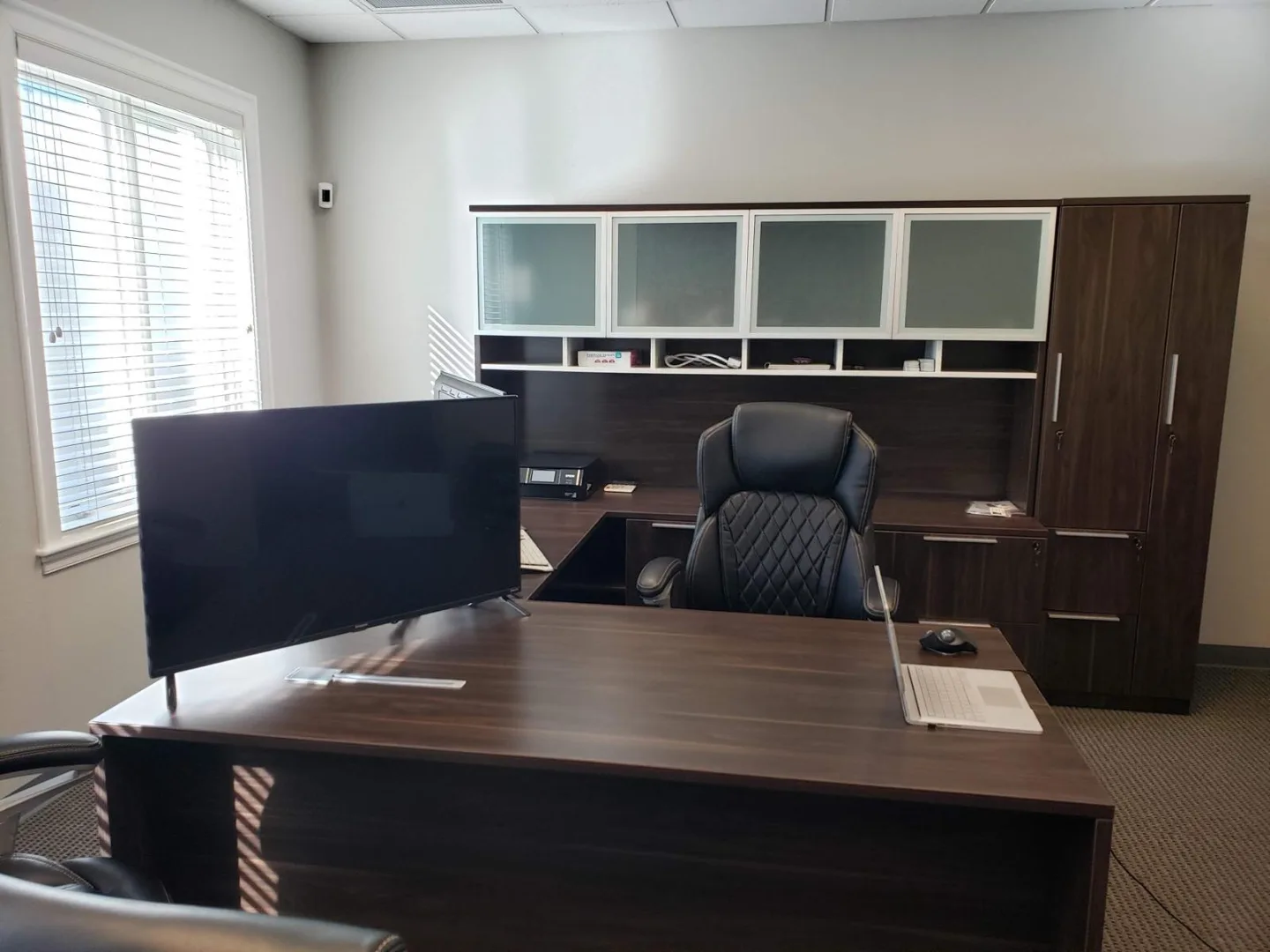 Private office with dual monitors inside the Actual SEO Media, Inc. Woodlands suite